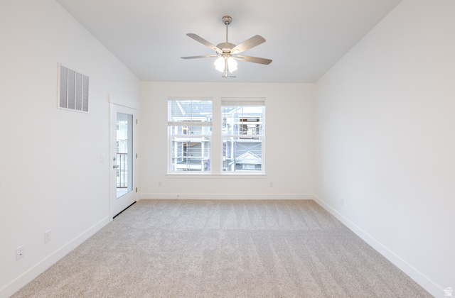 4661 Poplar Way, Unit R302 Mapleton, UT 84664 - Photo 15 of 17 Spare room with light carpet and a ceiling fan