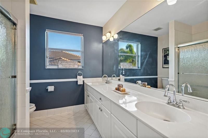 4290 Diamond Drive Weston, FL 33331 - Photo 16 of 26 a bathroom with a double vanity sink and mirror