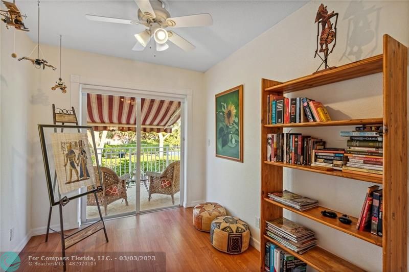 4290 Diamond Drive Weston, FL 33331 - Photo 18 of 26 a view of a workspace with furniture and a book shelf