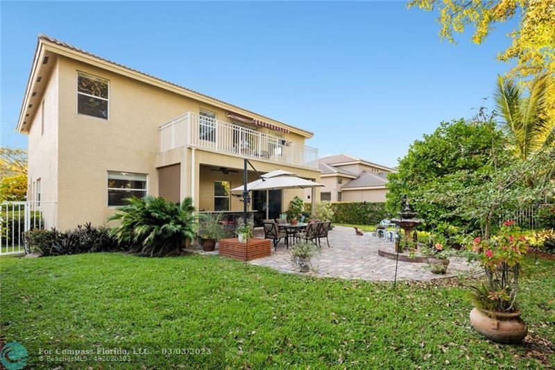 4290 Diamond Drive Weston, FL 33331 - Photo 22 of 26 a front view of a house with garden and sitting area