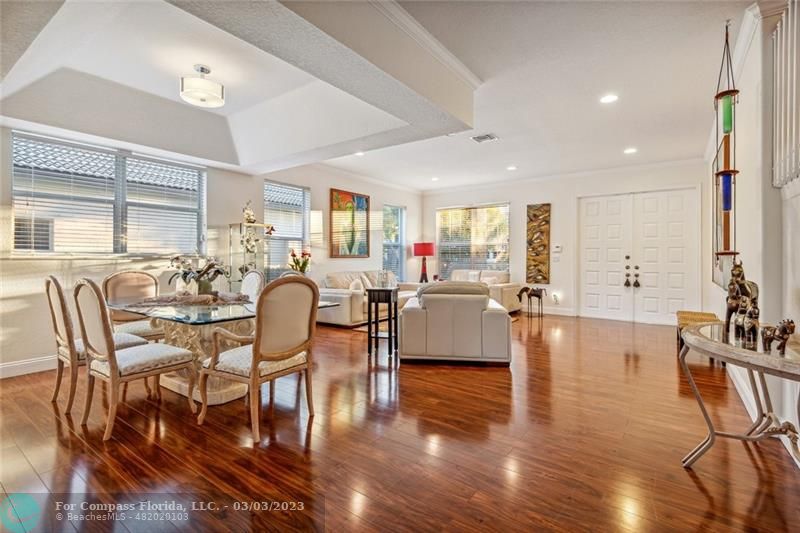 4290 Diamond Drive Weston, FL 33331 - Photo 5 of 26 a living room with furniture dining table and a large window