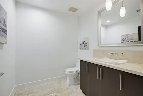 a bathroom with a mirror a double vanity sink and shower
