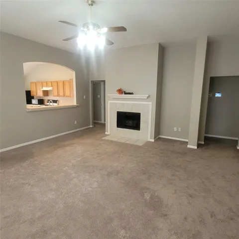 a bathroom with a sink mirror and toilet