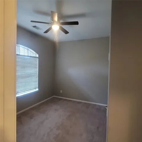 a workspace with furniture and window