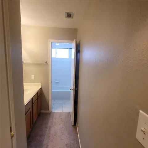 a view of a house with a swimming pool and a yard