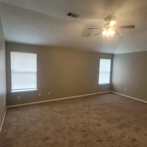 a view of a backyard with a fence