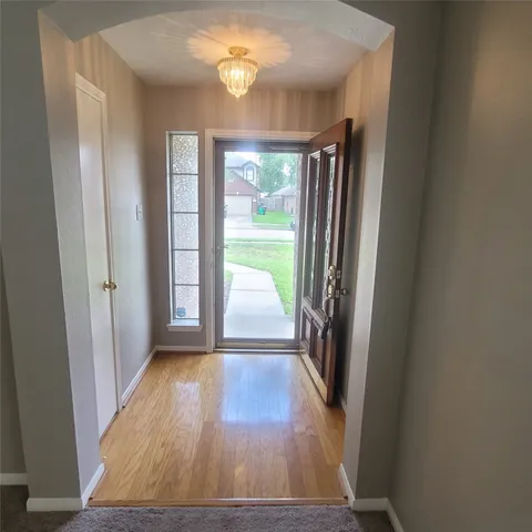 a kitchen with a sink a stove top oven and refrigerator