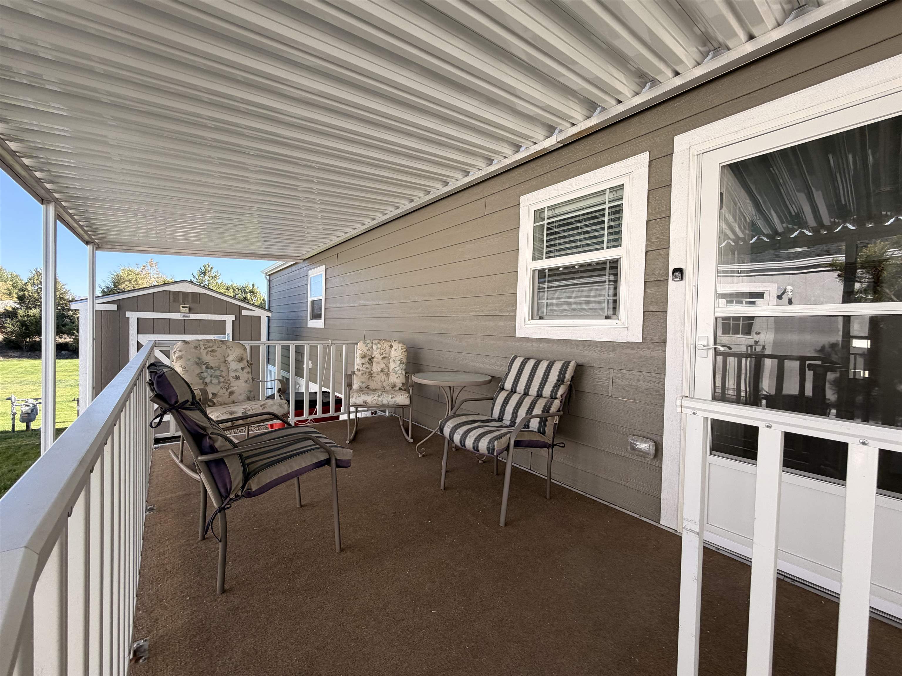 435 32 Road, Unit 826 Clifton, CO 81520 - Photo 12 of 17 a roof deck with a chair and table