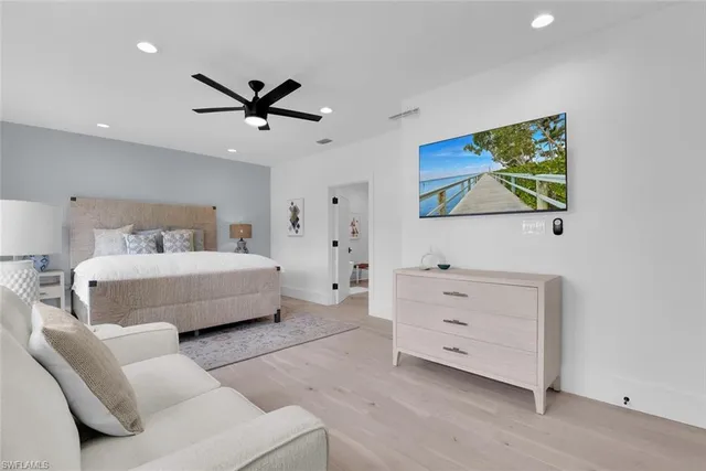 a bedroom with a bed and a dresser