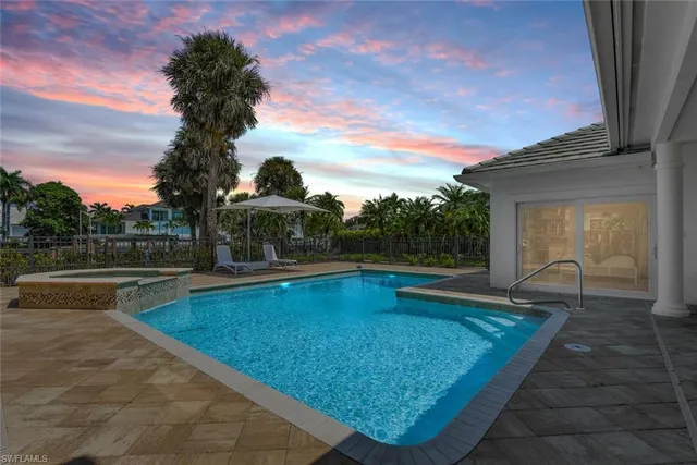 a view of swimming pool with seating space