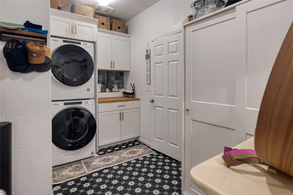a utility room with sink dryer and washer