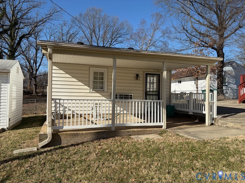 2820 Mauldin Street Richmond, VA 23223 - Photo 15 of 19 a front view of a house with garden