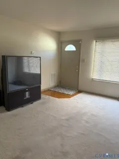 a view of a wooden chairs on the deck