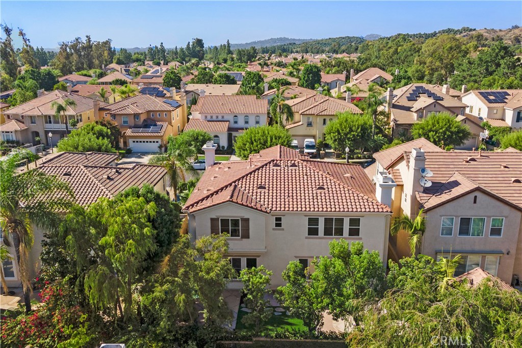10 Plumbago Irvine, CA 92620 - Photo 13 of 16 an aerial view of multiple houses with a yard