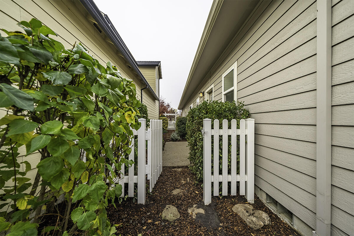 1078 North Haskell Street Central Point, OR 97502 - Photo 20 of 25 a view of a pathway of a house with a flower garden