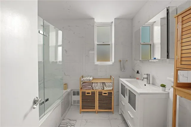 a bathroom with a sink and a washing machine