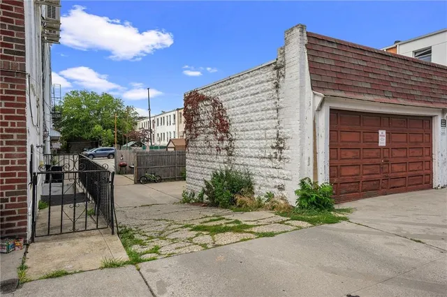 a front view of a building with parking area