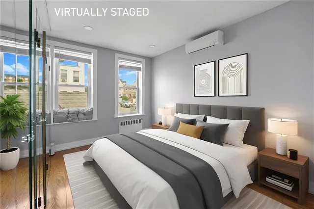 a bedroom with a bed and a window