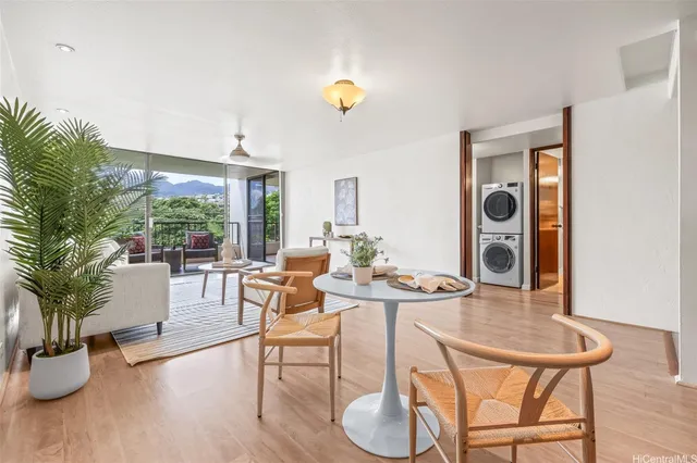 a view of a dining room with furniture and wooden floor