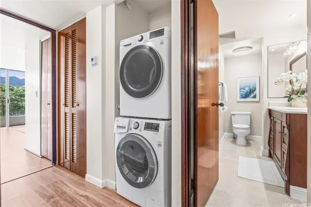 a view of a hallway with washer and dryer
