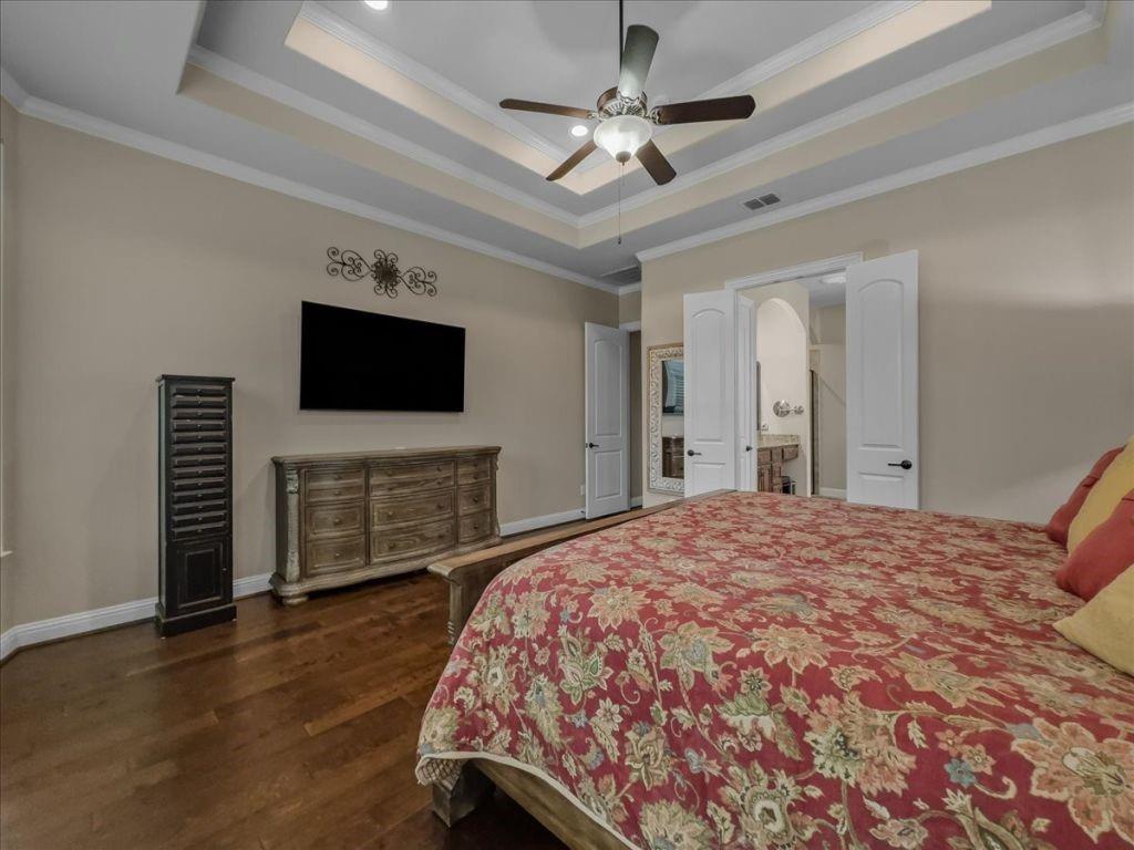 2832 Mona Vale Road Trophy Club, TX 76262 - Photo 19 of 37 a bedroom with a bed and a flat screen tv