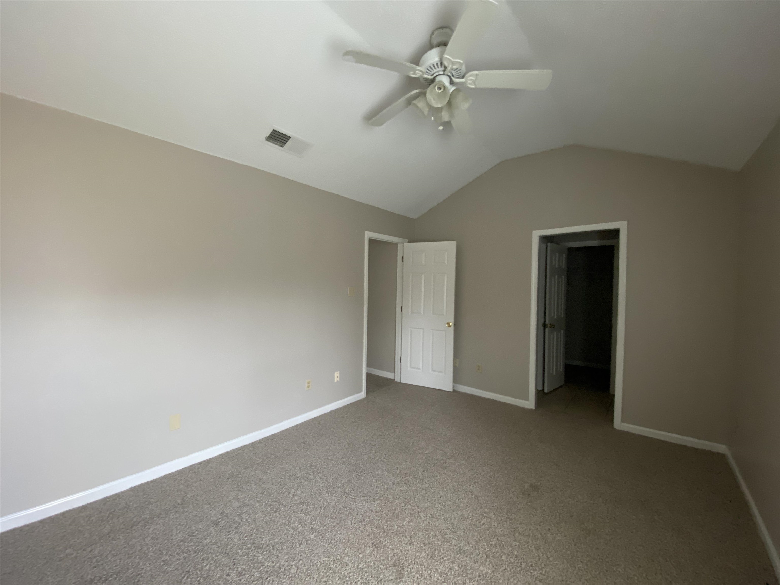 5950 Chadwell Road Millington, TN 38053 - Photo 8 of 14 Unfurnished bedroom with carpet flooring, a ceiling fan, and a walk in closet