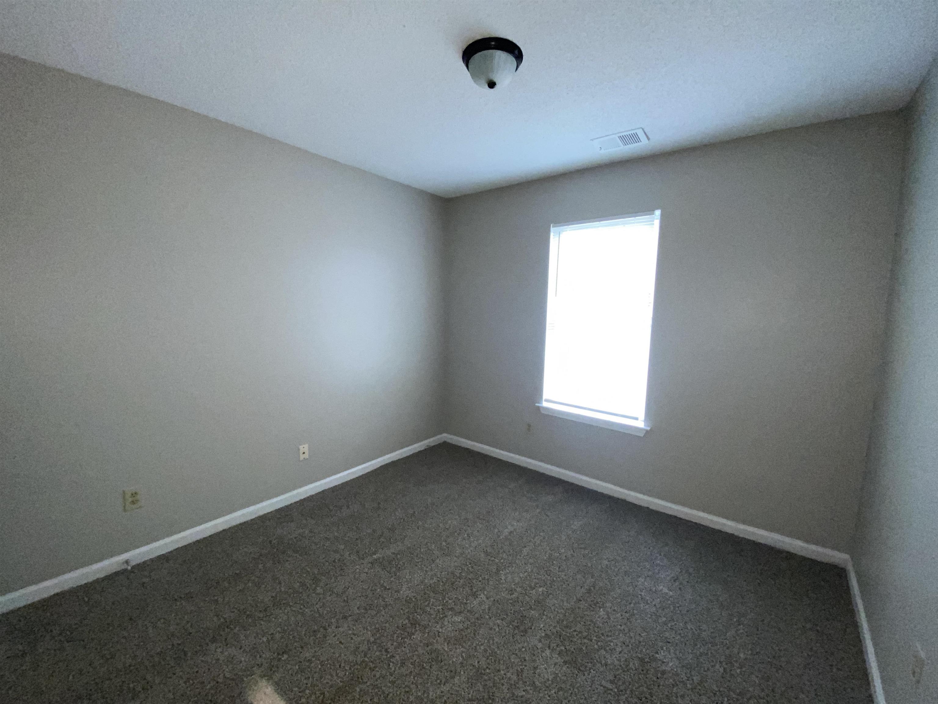 5950 Chadwell Road Millington, TN 38053 - Photo 9 of 14 Unfurnished room featuring carpet floors and baseboards