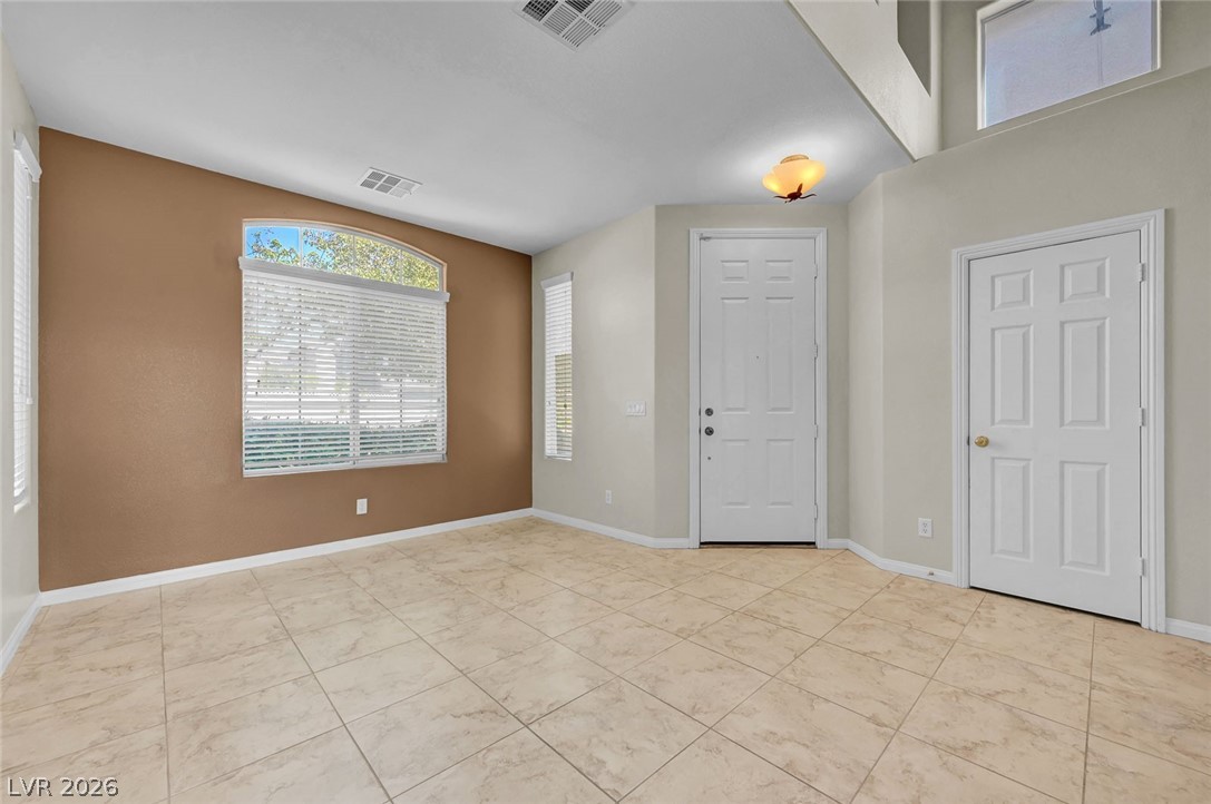 977 Sparkling Light Street Henderson, NV 89052 - Photo 19 of 75 This bright and airy room offers abundant natural light and versatile living space.