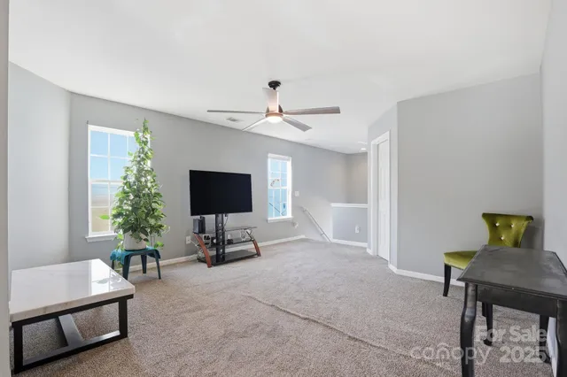 a view of livingroom with furniture and a window