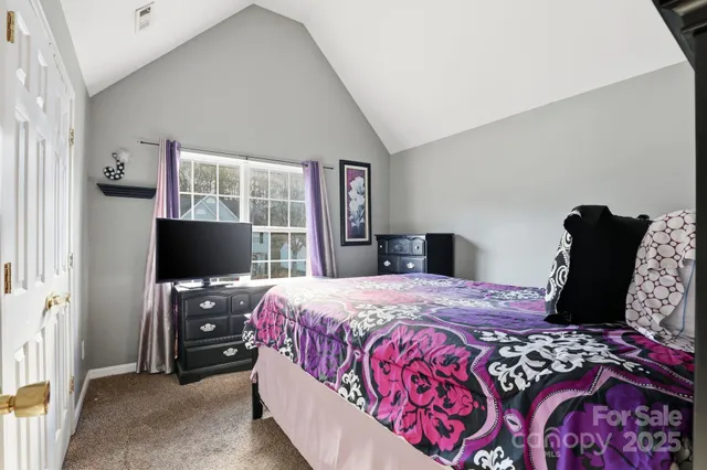 a bedroom with bed and window