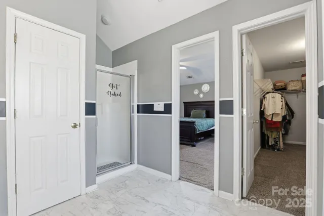 a bathroom with a tub a sink and mirror