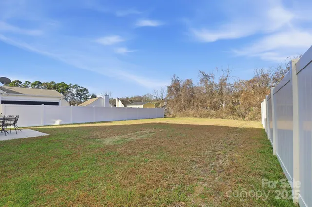 a view of a backyard with a cabin
