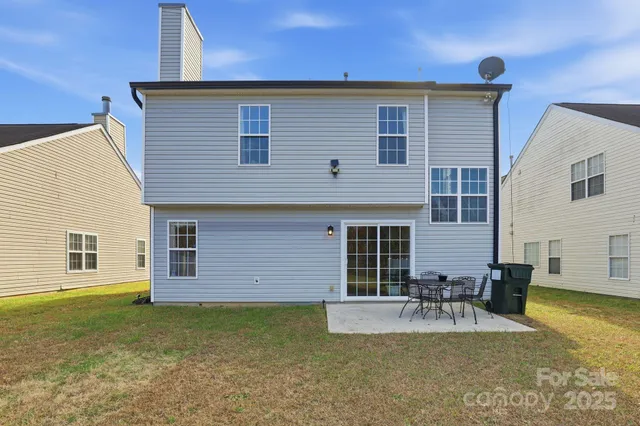 a swimming pool with buildings in the background