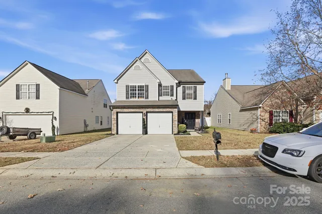 a view of a house with a street