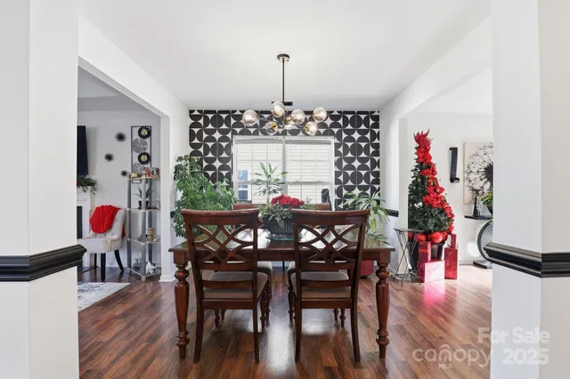 a kitchen with a refrigerator and a stove top oven