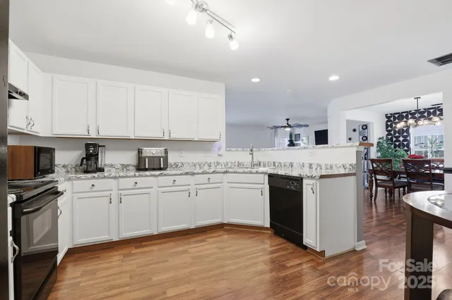a view of a kitchen and dining room