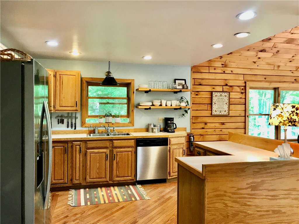 207 Pheasant Run Road Middlefield, NY 13326 - Photo 14 of 44 Kitchen with hardwood floors