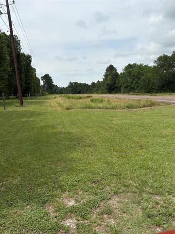 a view of a lake with houses in the back