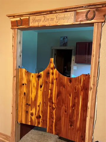 a bedroom with two beds and a desk