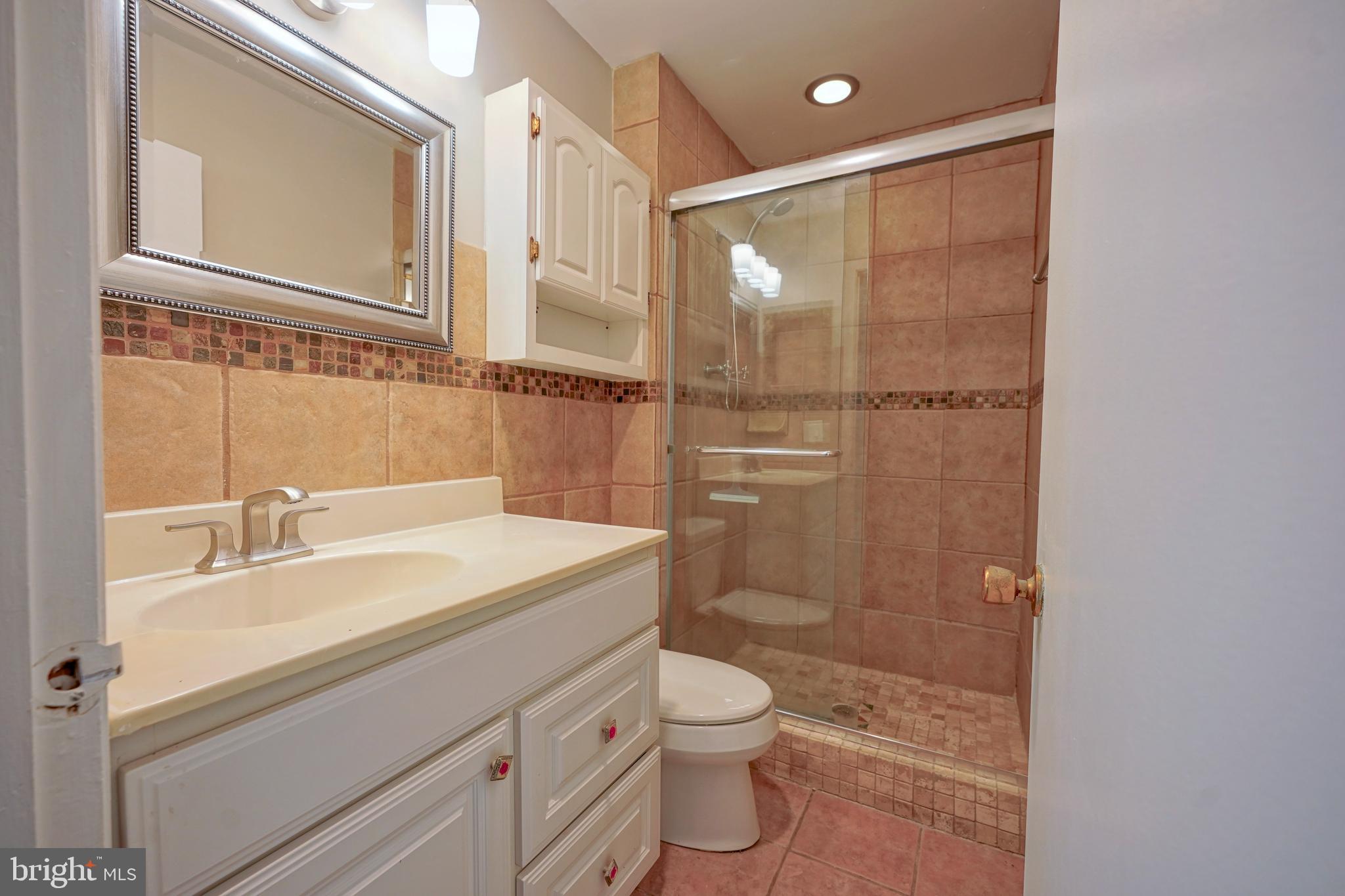 1035 Pendleton Court Voorhees, NJ 08043 - Photo 16 of 29 a bathroom with a sink a toilet and shower