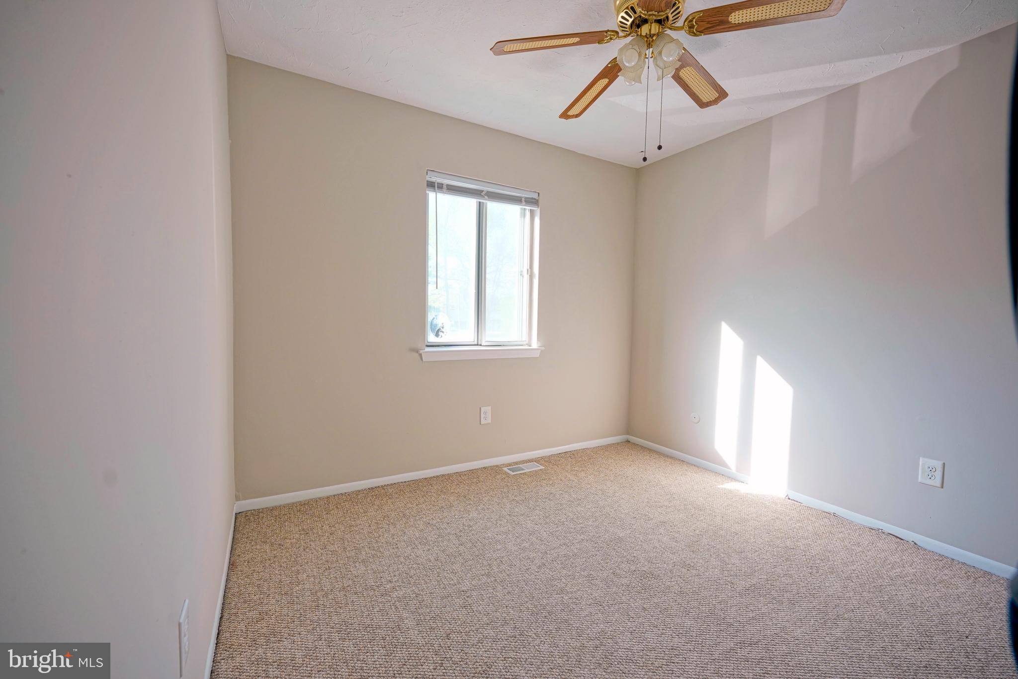 1035 Pendleton Court Voorhees, NJ 08043 - Photo 22 of 29 an empty room with a window and a chandelier fan
