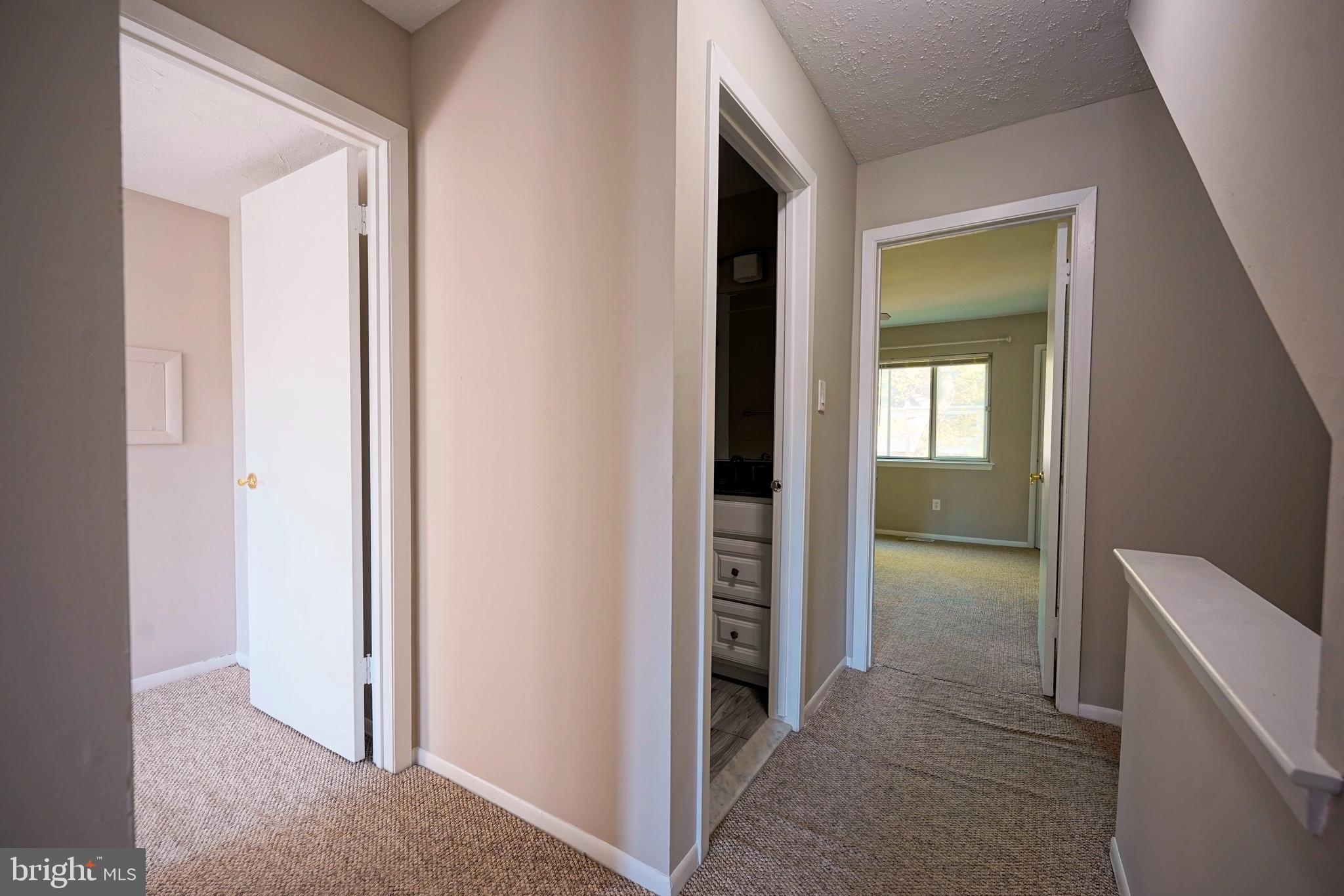 1035 Pendleton Court Voorhees, NJ 08043 - Photo 23 of 29 a view of a hallway with wooden floor and a livingroom