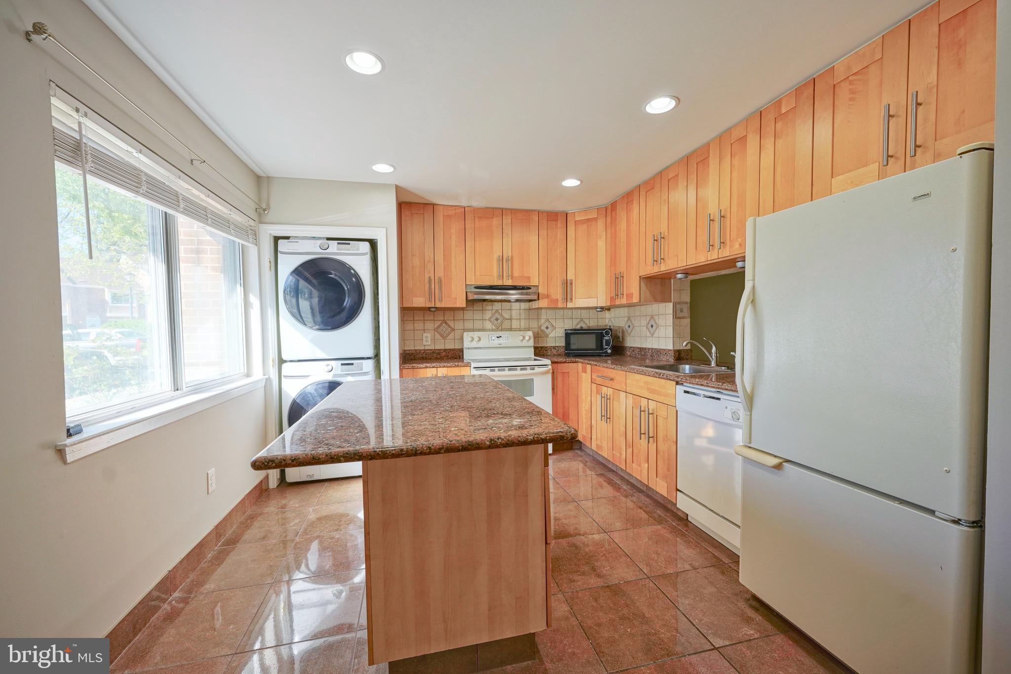 1035 Pendleton Court Voorhees, NJ 08043 - Photo 8 of 29 a kitchen with kitchen island granite countertop a refrigerator a sink dishwasher a stove and white cabinets with wooden floor