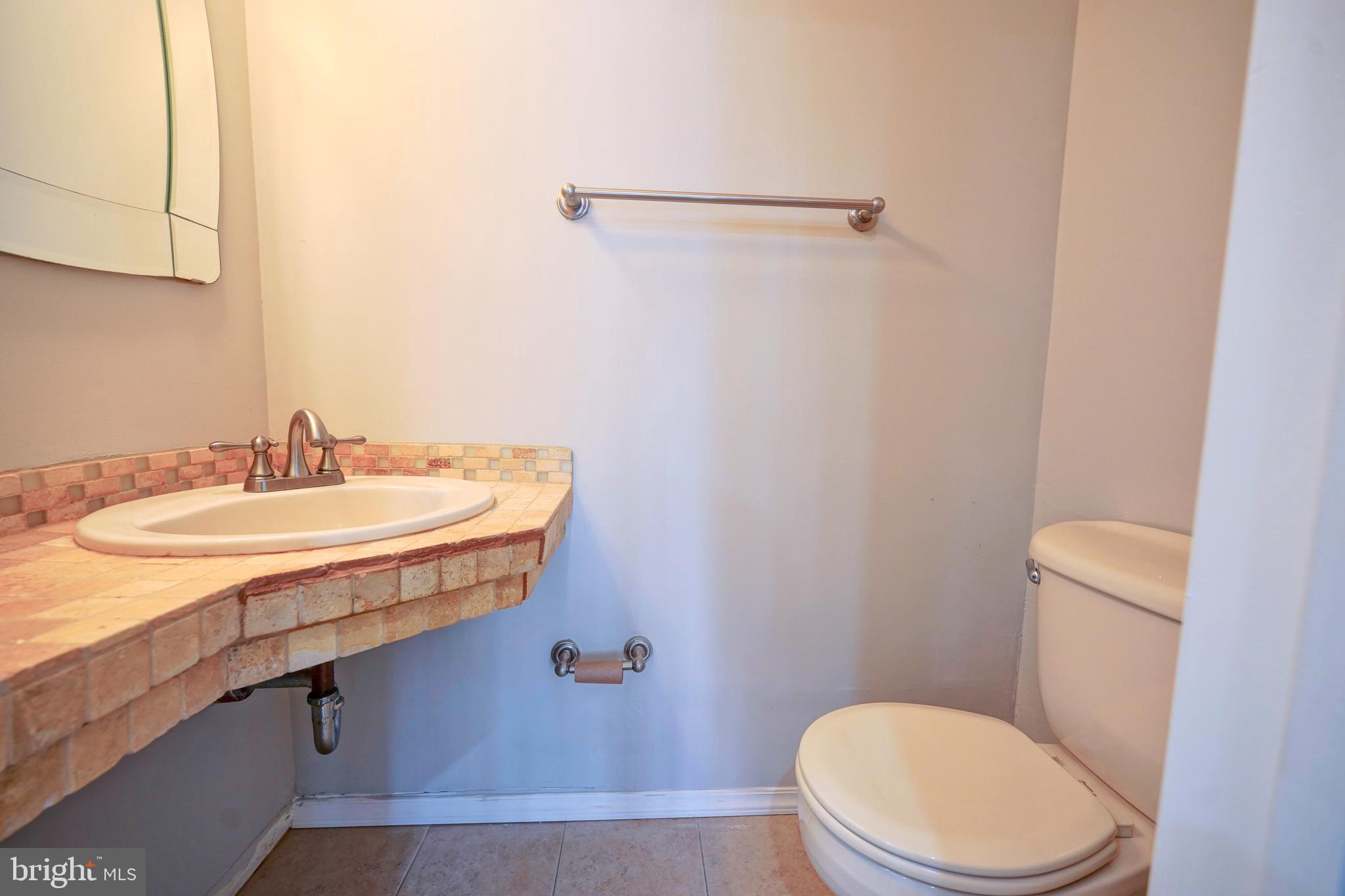 1035 Pendleton Court Voorhees, NJ 08043 - Photo 10 of 29 a bathroom with a granite countertop sink a toilet and a mirror