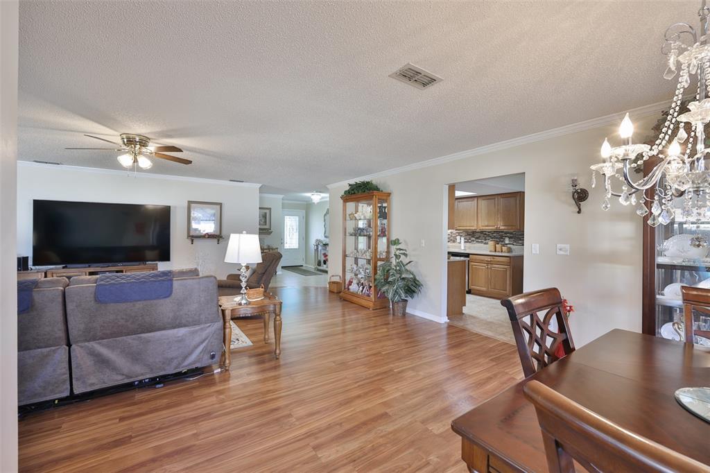 1806 Wedge Court Sun City Center, FL 33573 - Photo 18 of 53 a living room with furniture and a flat screen tv