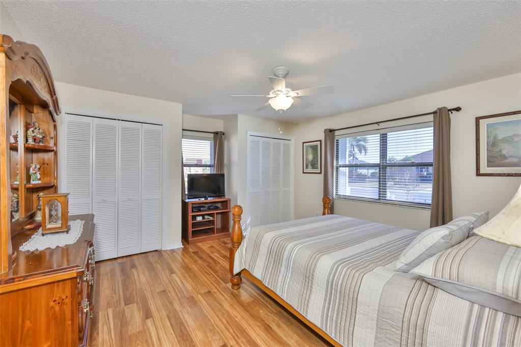 1806 Wedge Court Sun City Center, FL 33573 - Photo 32 of 53 a bedroom with a bed and a large window