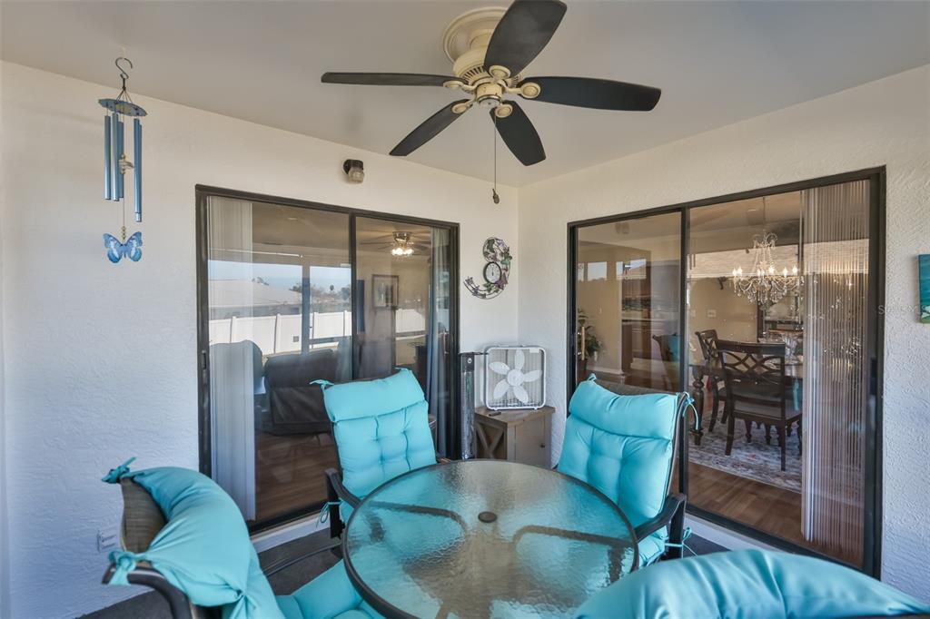 1806 Wedge Court Sun City Center, FL 33573 - Photo 37 of 53 a view of a livingroom with furniture and a dining table with wooden floor