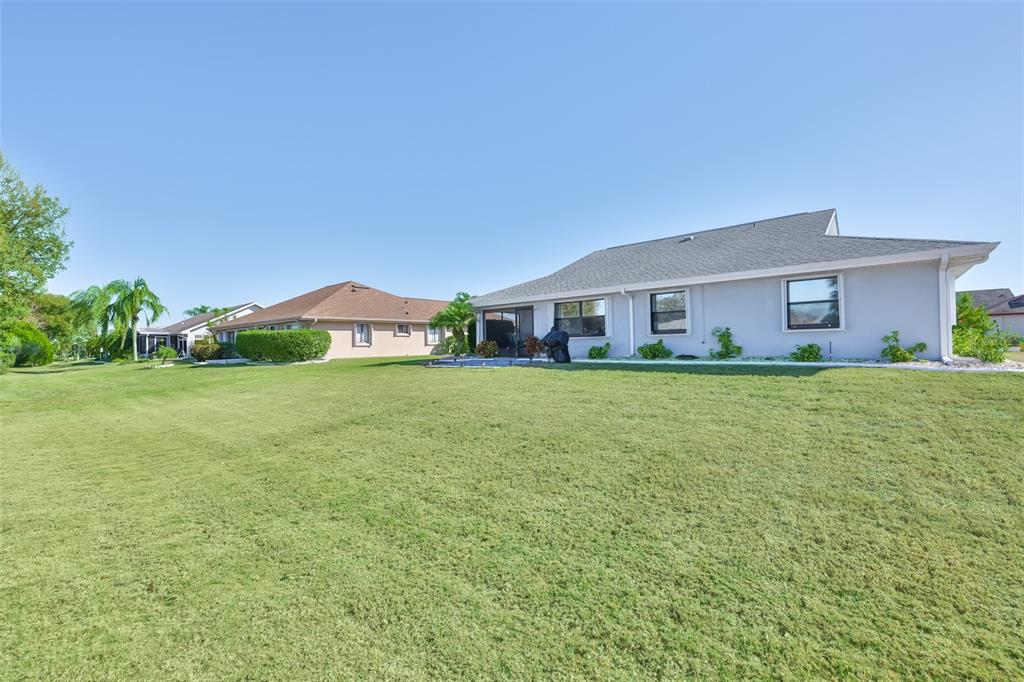 1806 Wedge Court Sun City Center, FL 33573 - Photo 41 of 53 a front view of house with yard and green space