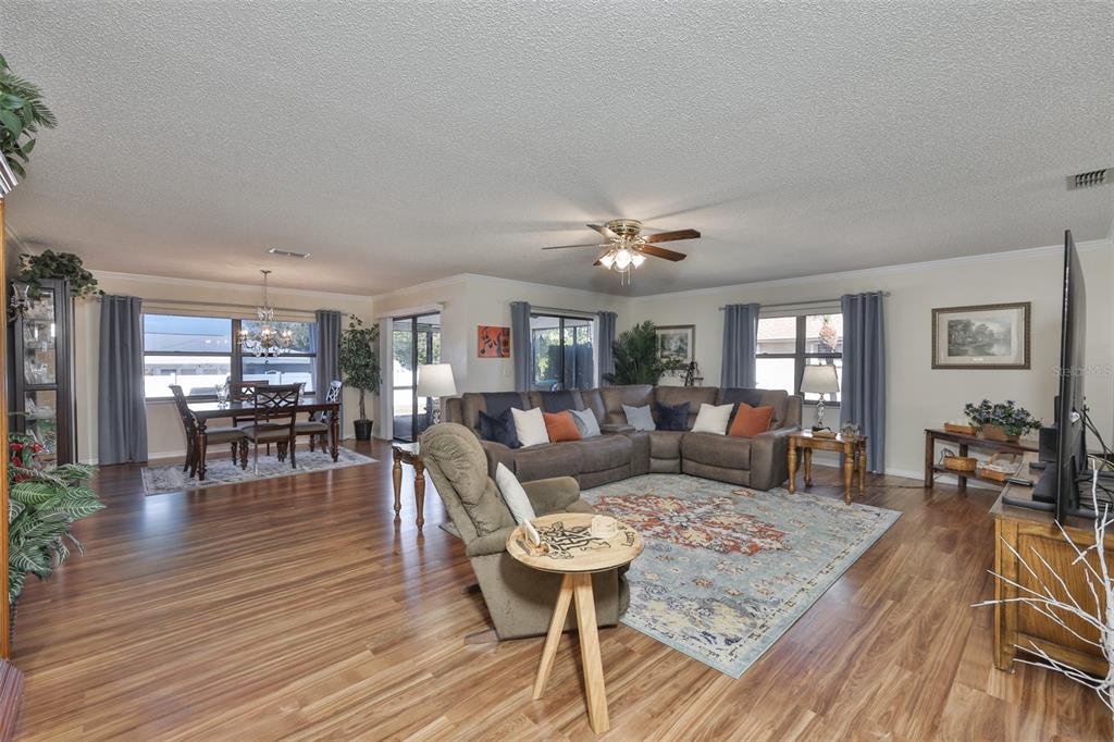 1806 Wedge Court Sun City Center, FL 33573 - Photo 10 of 53 a living room with furniture and wooden floor