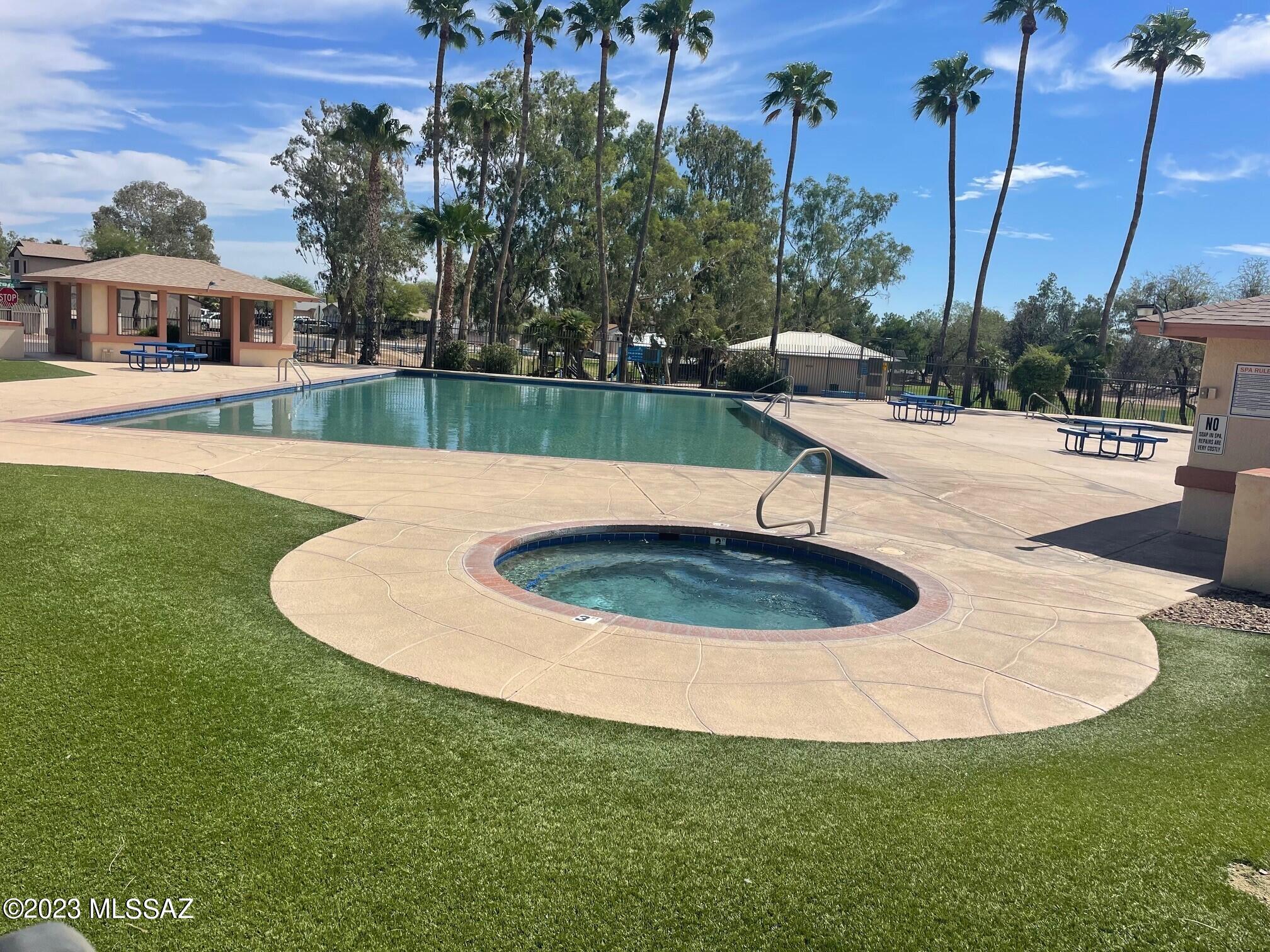 2701 West Firebrook Road Tucson, AZ 85741 - Photo 26 of 28 a view of a swimming pool with a yard